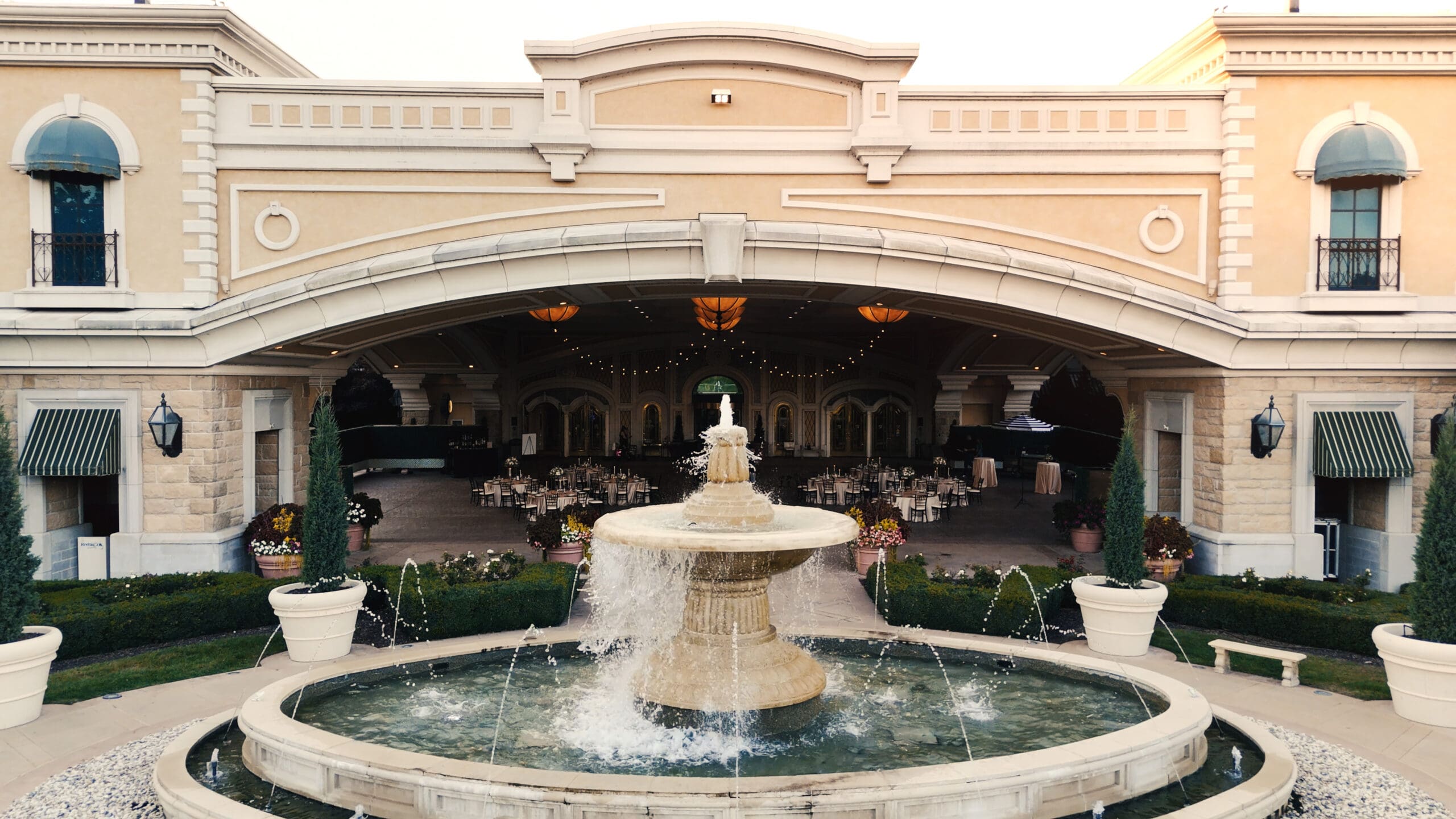 River City Casino wedding venue entrance with fountain at sunset in St. Louis