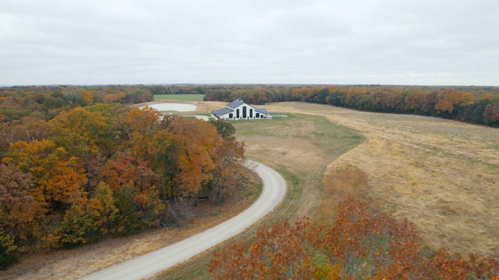 Aerial view of Wildflower Ridge wedding venue in Missouri with open countryside, barn venue, and private landscape