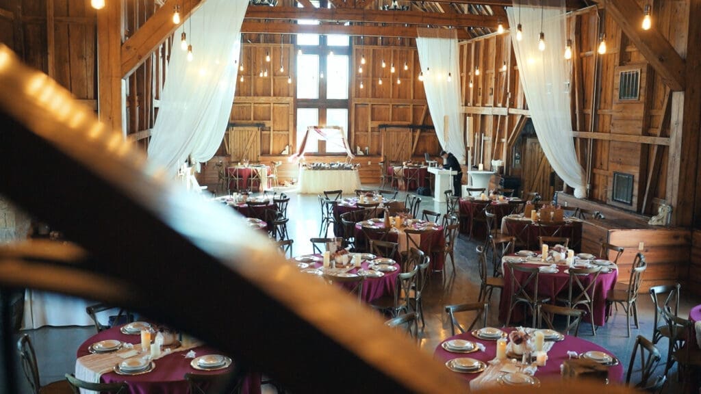 Wedding reception setup inside the rustic Red Barn at Red Oak Valley